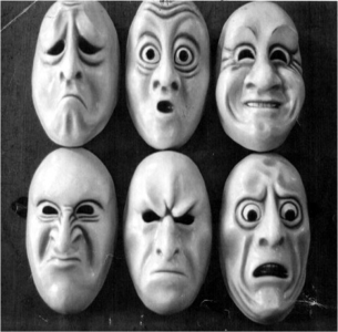 Five masks with expressions depicting different attitudes in black and white.