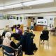 Community forum members listening to presentation